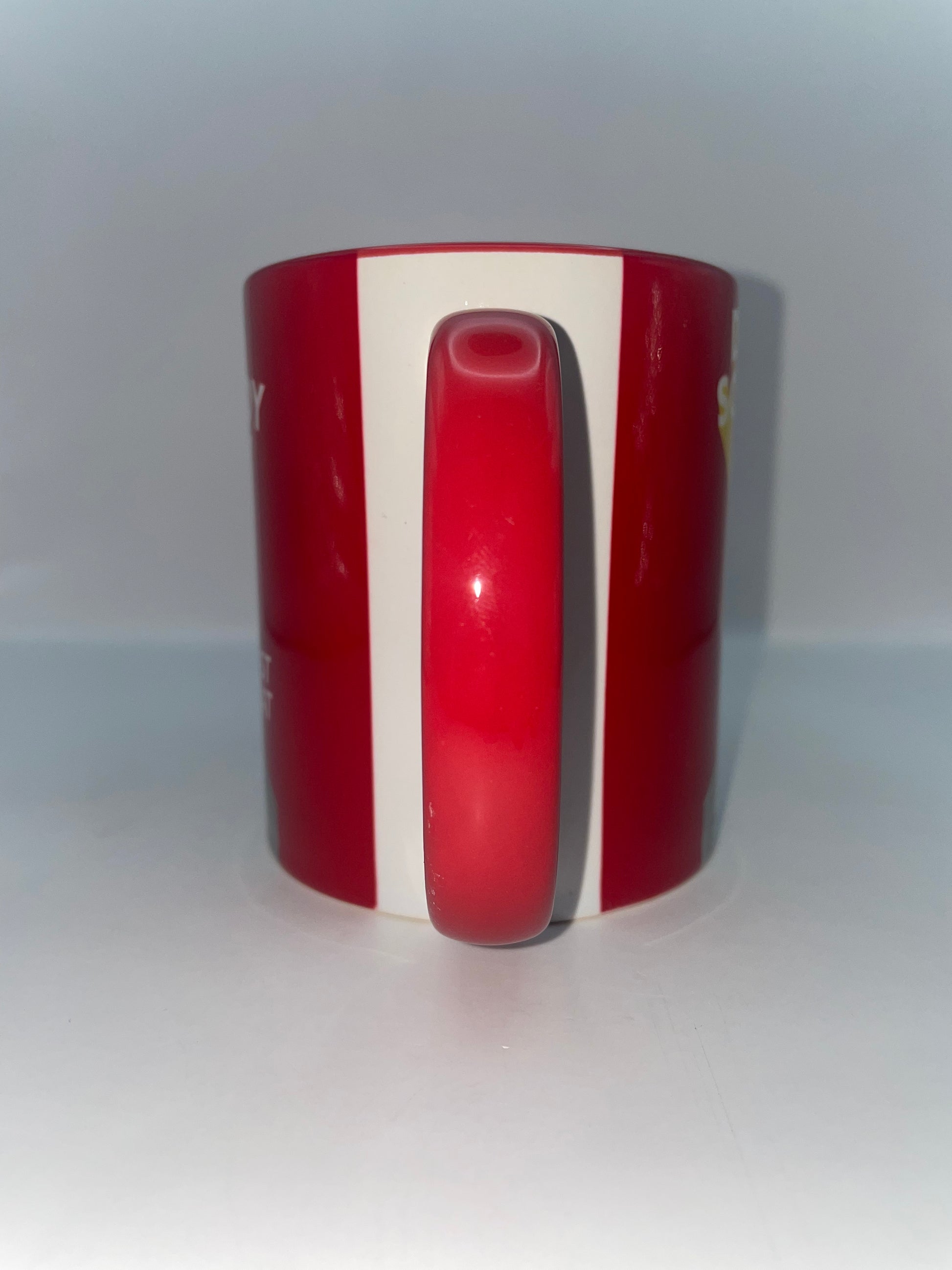 Red and white striped mug on a white background